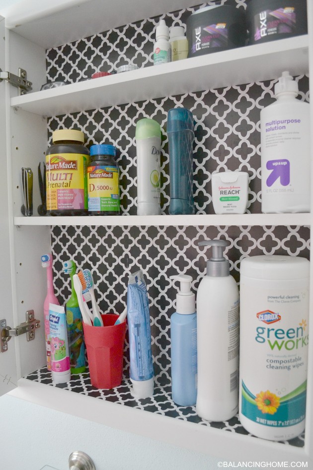 cleaning-organizing-bathroom-with-pedestal-sink-medicine-cabinet-2